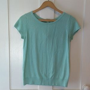Short sleeved zip up knit top